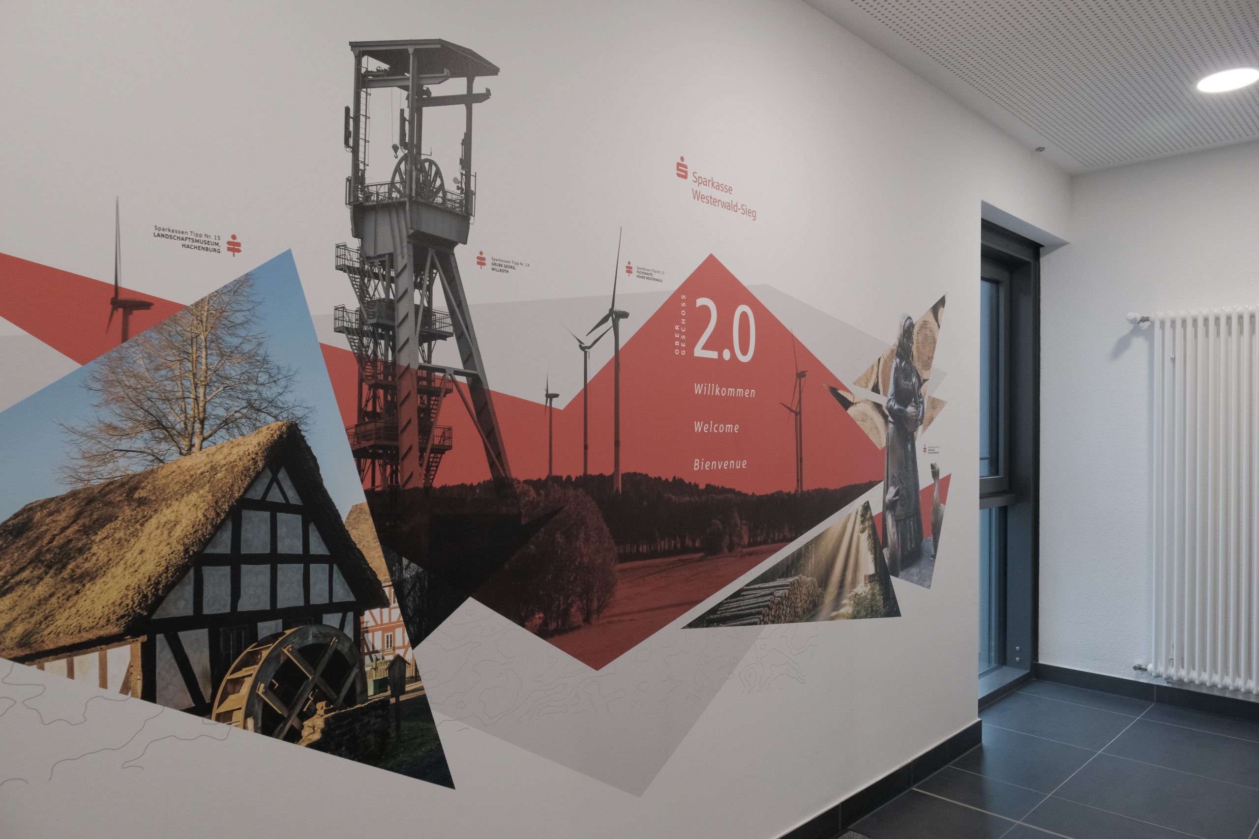 Direct-to-wall interior mural printing with custom graphics integrated seamlessly into a modern office space
